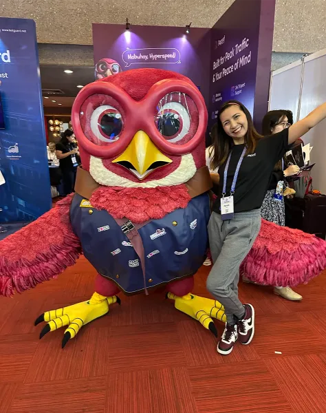 Fleet posing at the Rapyd Cloud booth